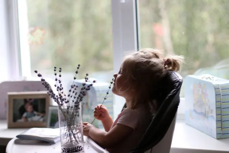 girl sniffing a flower 2021 11 02 17 58 41 utc 1 768x512 1