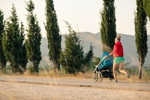 mother with baby stroller running at sunset landsc PG3A5LB 1140x760 1